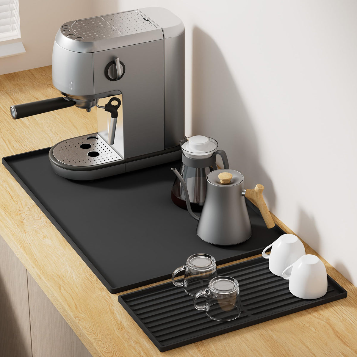 Golener silicone coffee mat set placed under a coffee maker protecting the countertop from drips and heat