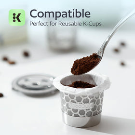GoodCups filter paper lining a reusable K cup for easier cleanup after brewing.