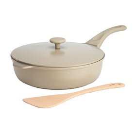 Goodful All-in-One Pan with lid on stove shows sturdy construction and even heat.