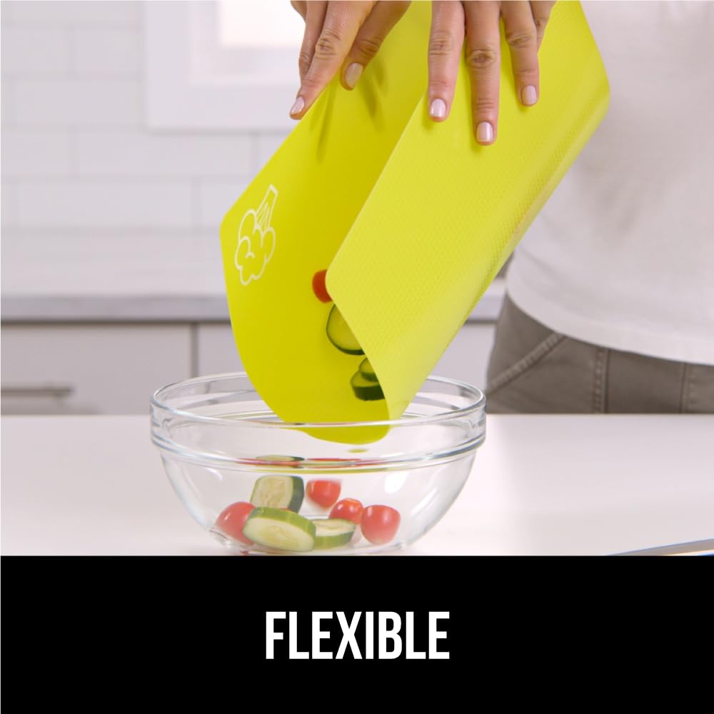 GORILLA GRIP cutting board folds easily to funnel chopped ingredients into pots.