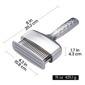 In-use Gourmet Easy tenderizer on a steak for even results.