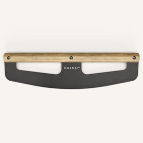 Gozney pizza rocker in action shows smooth rolling cuts keeping toppings in place