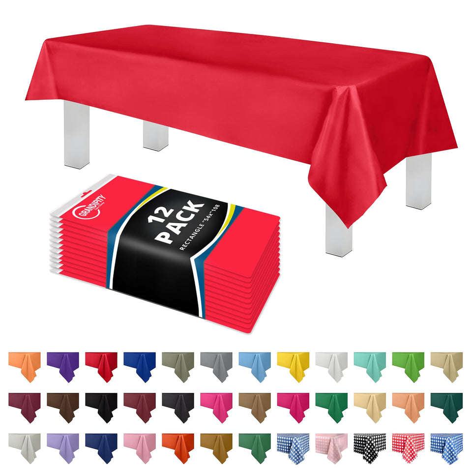 Grandipity red rectangle tablecloth unfolded on a dining table.