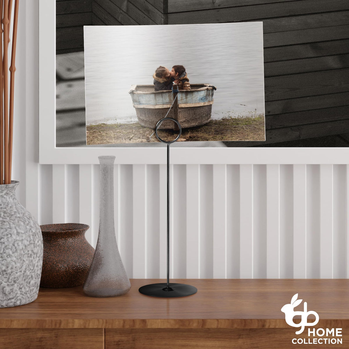 Gray Bunny black metal table stands with a stable base for signage at events.