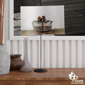 Gray Bunny black metal table stands with a stable base for signage at events.