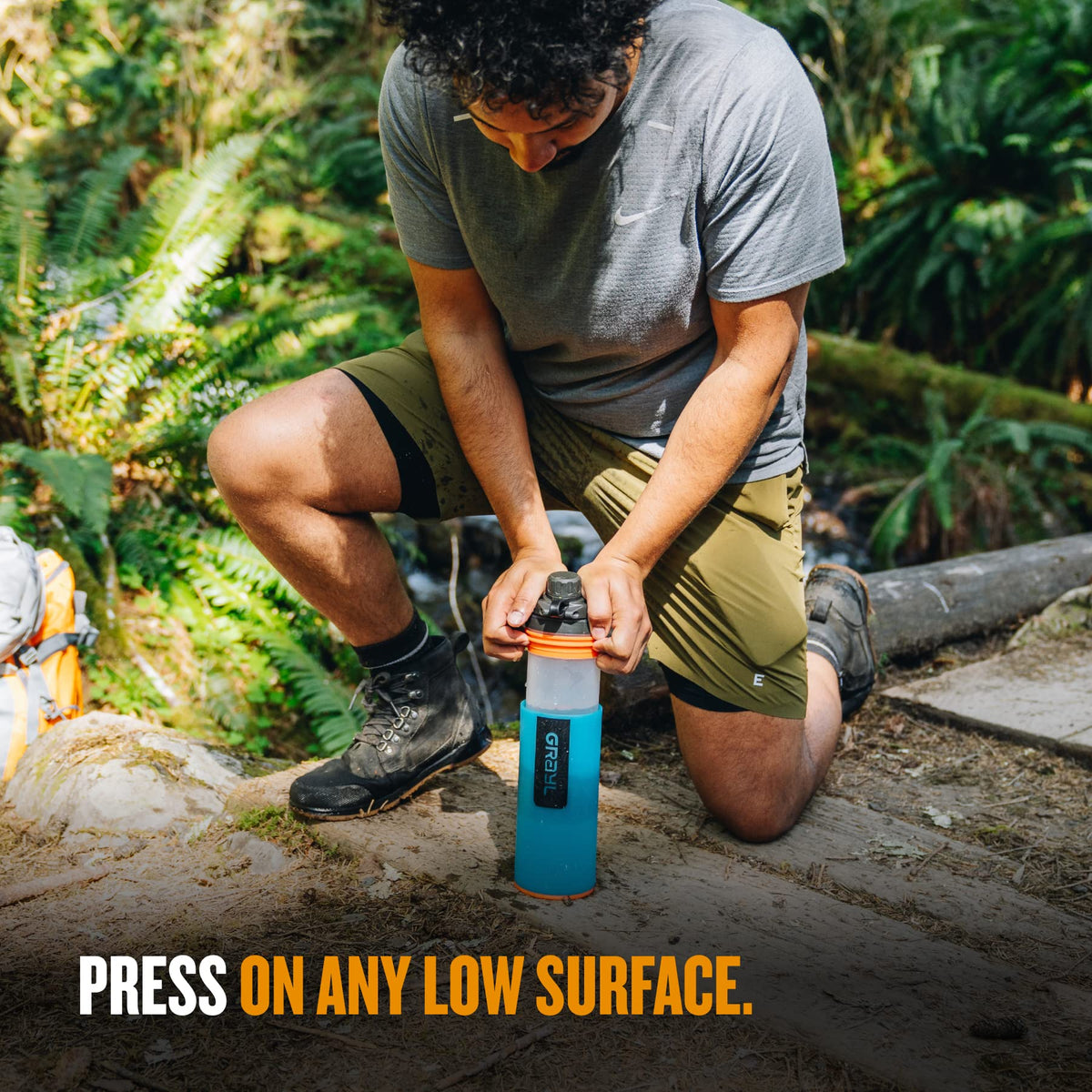 GRAYL GeoPress Bali Blue on a hiking backpack ready for use.
