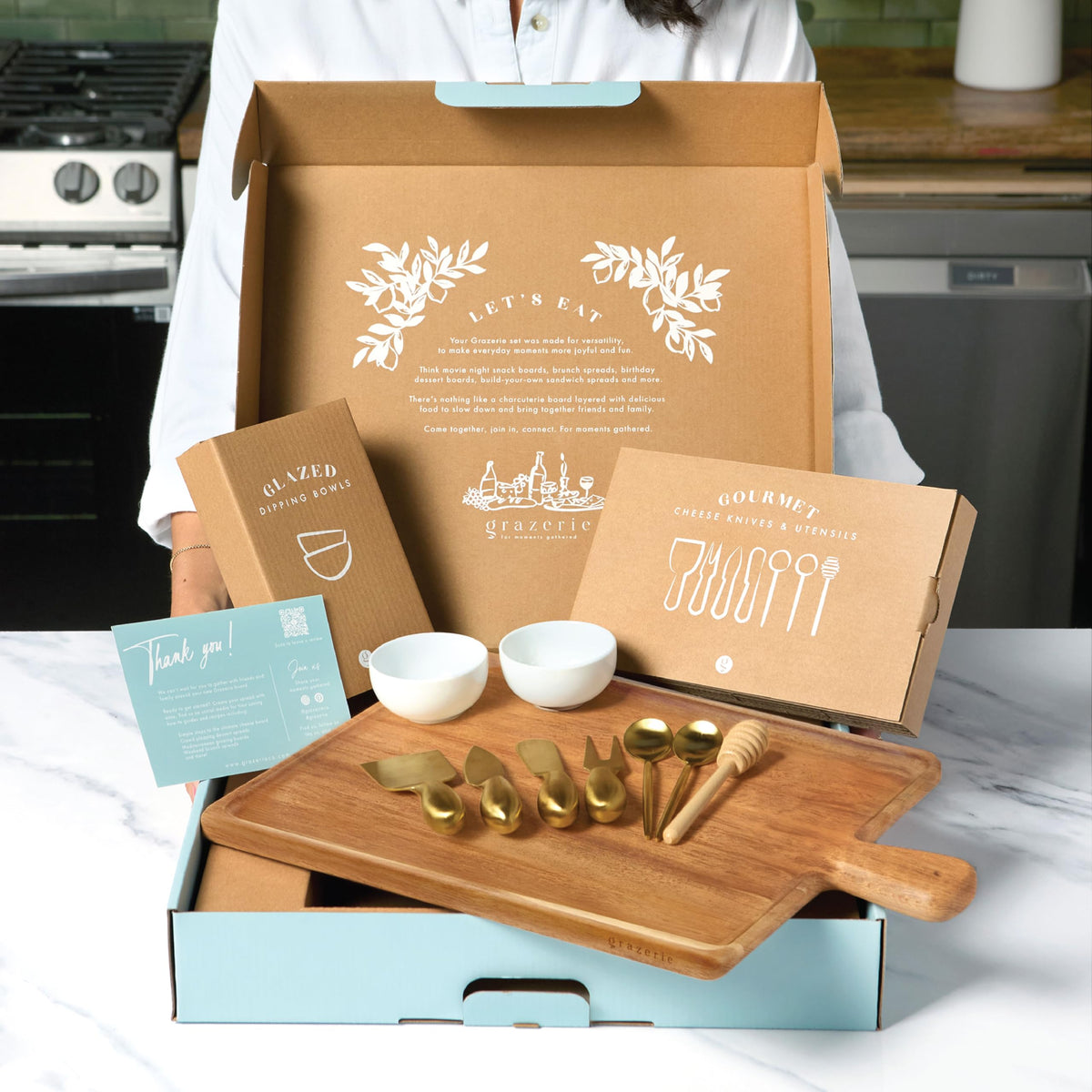 Grazerie Charcuterie Board Set with dishwasher-safe dipping bowls for easy cleanup.