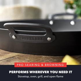 GreenPan x Bobby Flay paella pan on stove demonstrates high heat readiness.