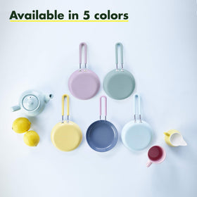 GreenPan mini egg pan handle close-up—stay-cool, slip-free grip for safe cooking.