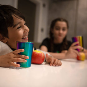 Greens Steel 10oz kids cups stacked for space-saving storage.