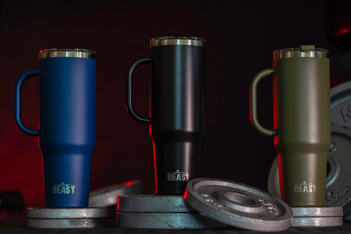 Greens Steel travel mug in office setting for workday hydration.
