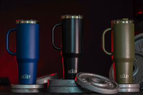 Greens Steel travel mug in office setting for workday hydration.
