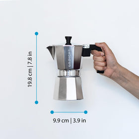 Milano moka pot with double-walled glass cups on display for serving.