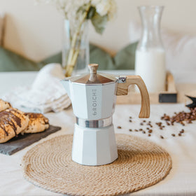 Steam pours as GROSCHE Milano Moka brews a cup of moka.