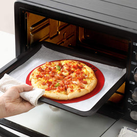 GUANCI heat-resistant mat shown in oven-ready setup.
