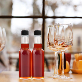 GUANENA BPA-free glass bottle offers safe, reusable storage.