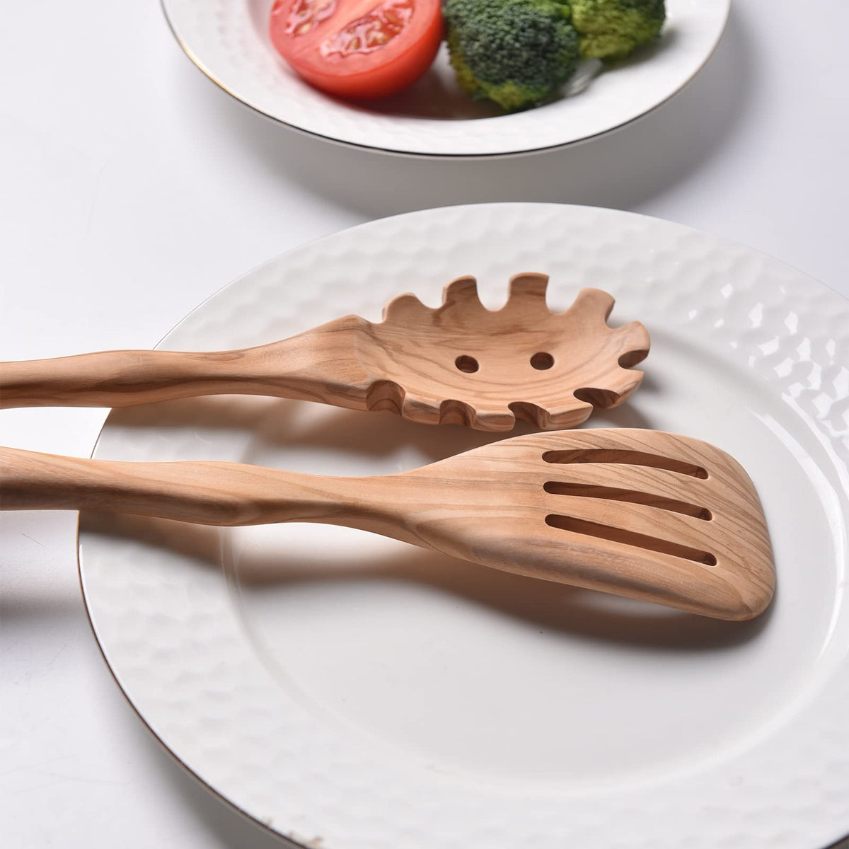 Gudamaye slotted spatula highlights a non-scratch olive wood surface.