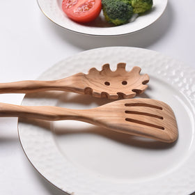Gudamaye slotted spatula highlights a non-scratch olive wood surface.