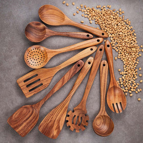 Gudamaye teak wooden spoons on a nonstick pan prevent scratching.