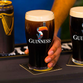 Guinness thick tulip pint glass designed to enhance aroma and taste.