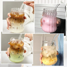 GUOJOZO glass cups on table setting, versatile for home bar or dessert shop use.