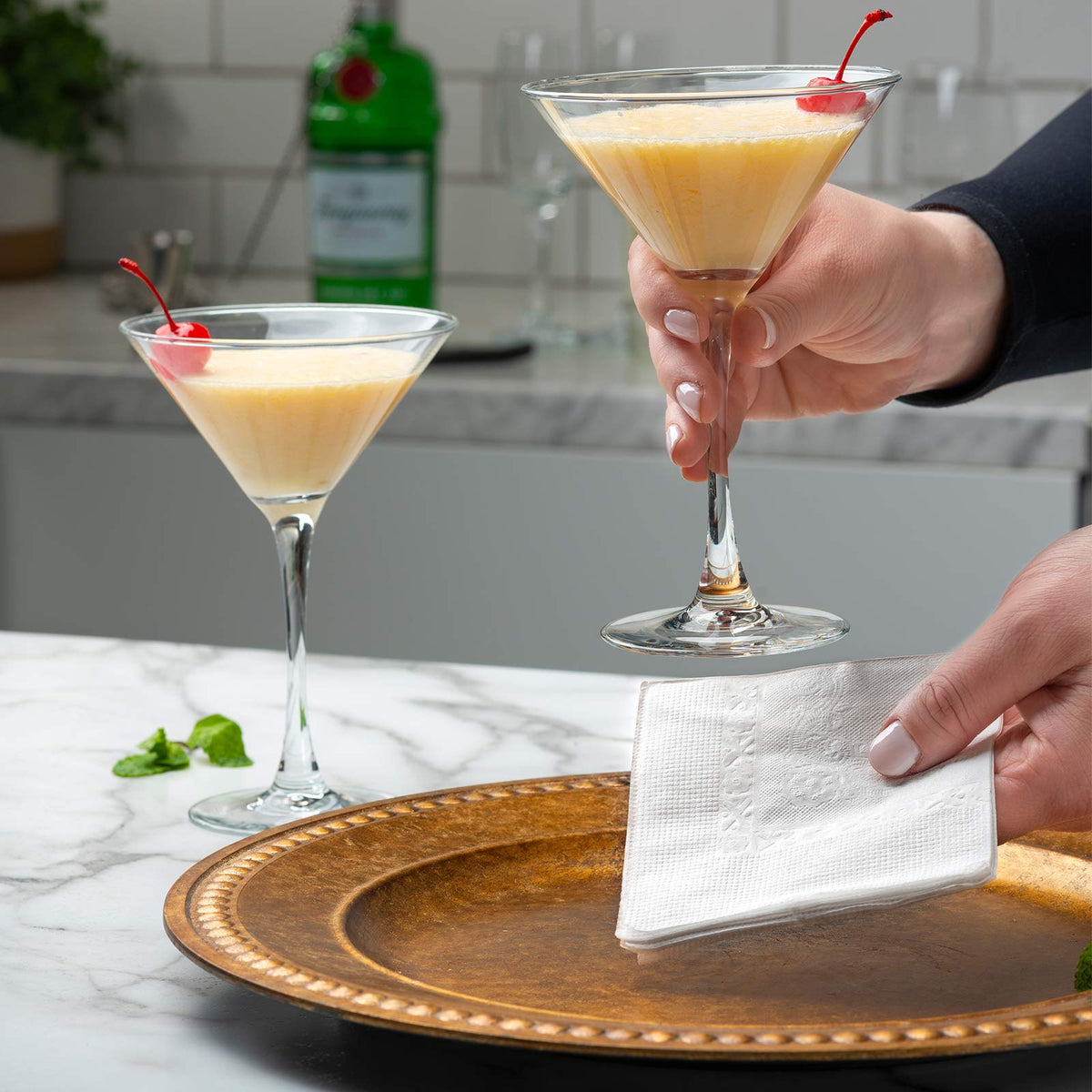 GUSTO white napkins unfolded to 9x9 for larger plate settings.