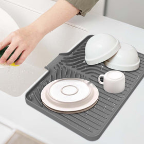 GUUKIN dish drying mat on countertop keeps dishes dry and ready.