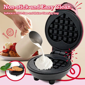 GVAKMM Mini Waffle Maker Heart pink uses green ready-light for fast prep.