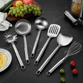 Gymdin whisk poised for beating eggs with a balanced handle