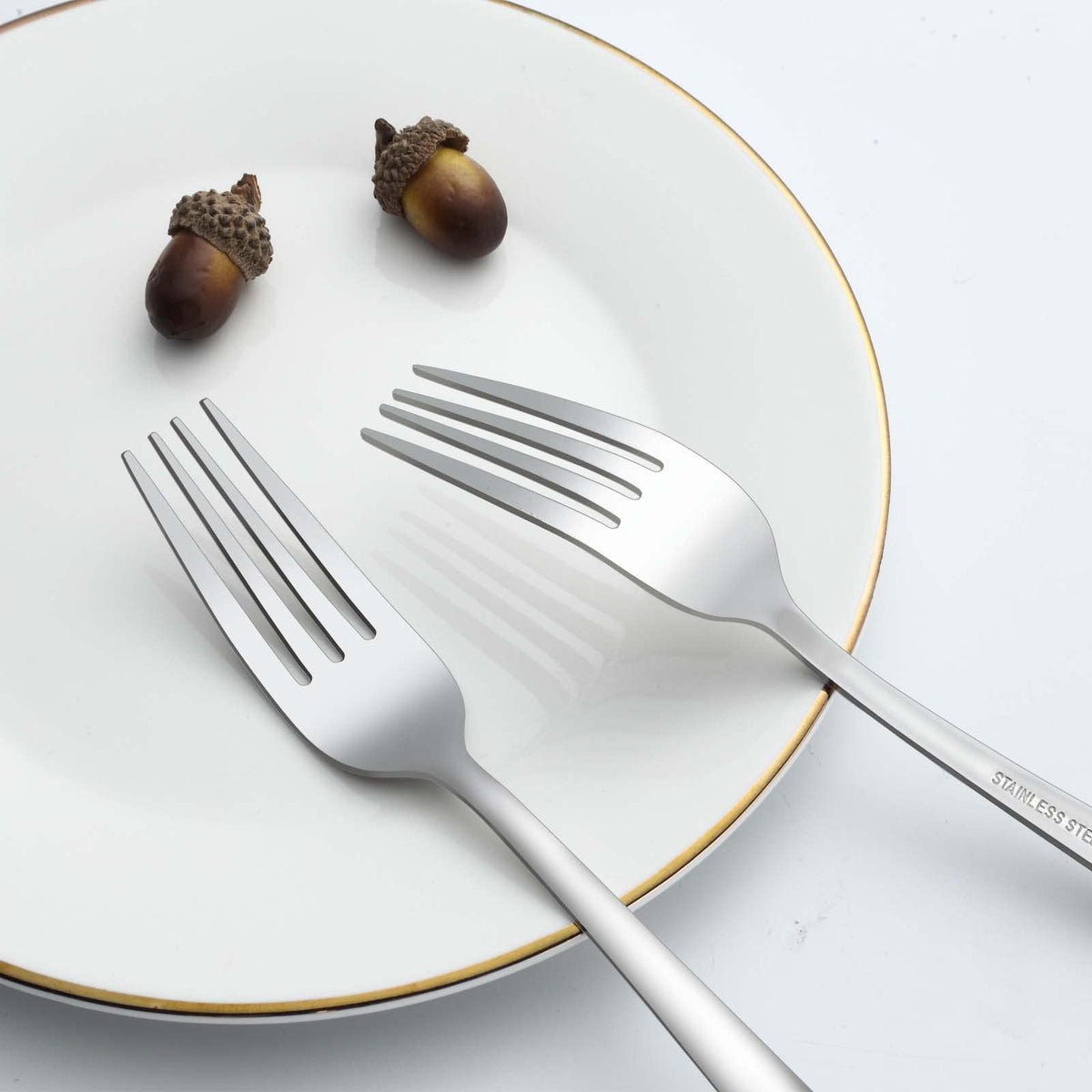 Gymdin mirror-polished flatware forks add elegance to table settings.
