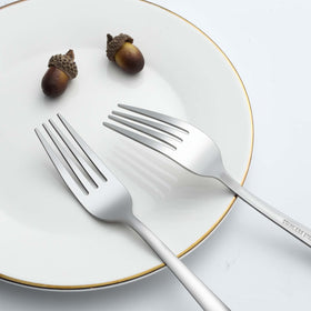 Gymdin mirror-polished flatware forks add elegance to table settings.