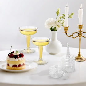Hacaroa wedding party table shot with clear stemmed champagne coupes.