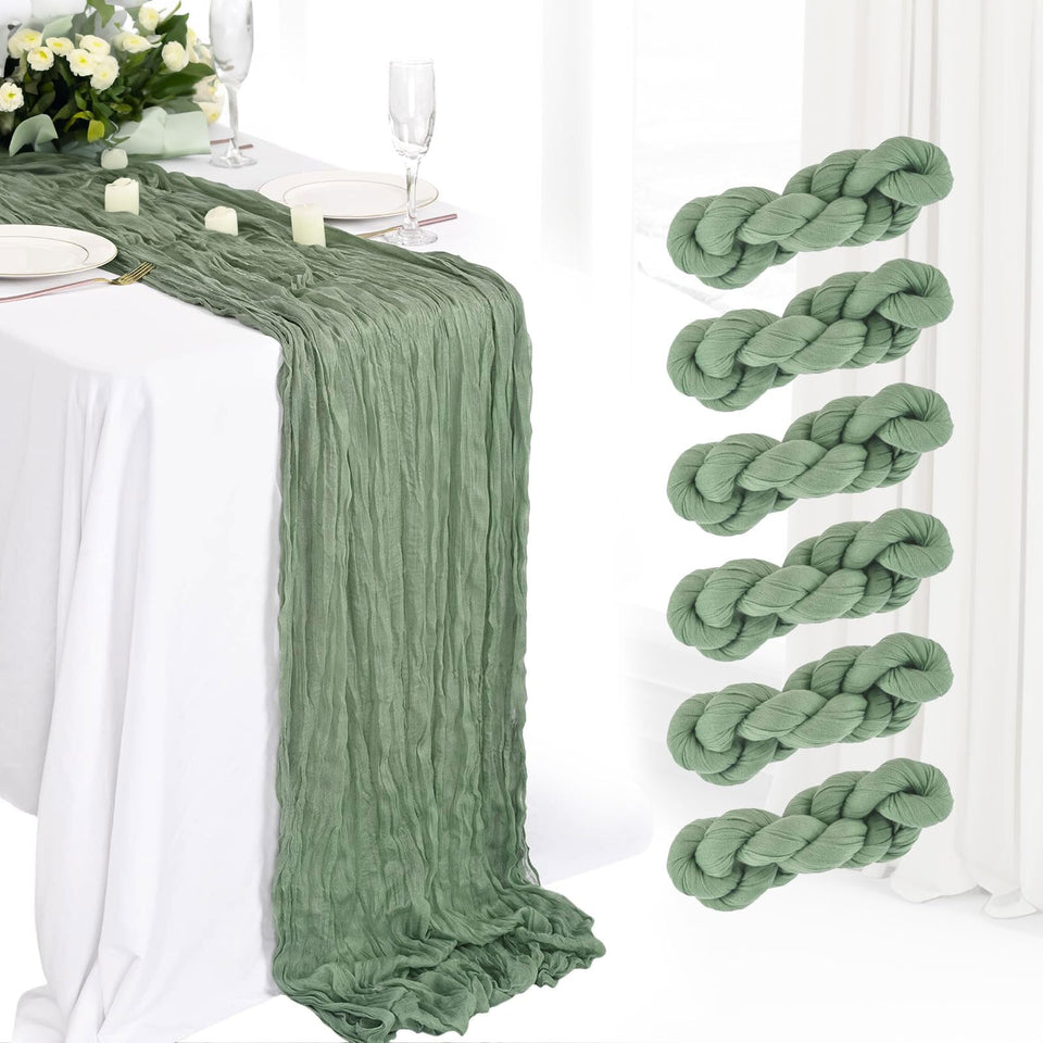 Haewlear sage green cheesecloth table runner draped on a rustic wedding table.