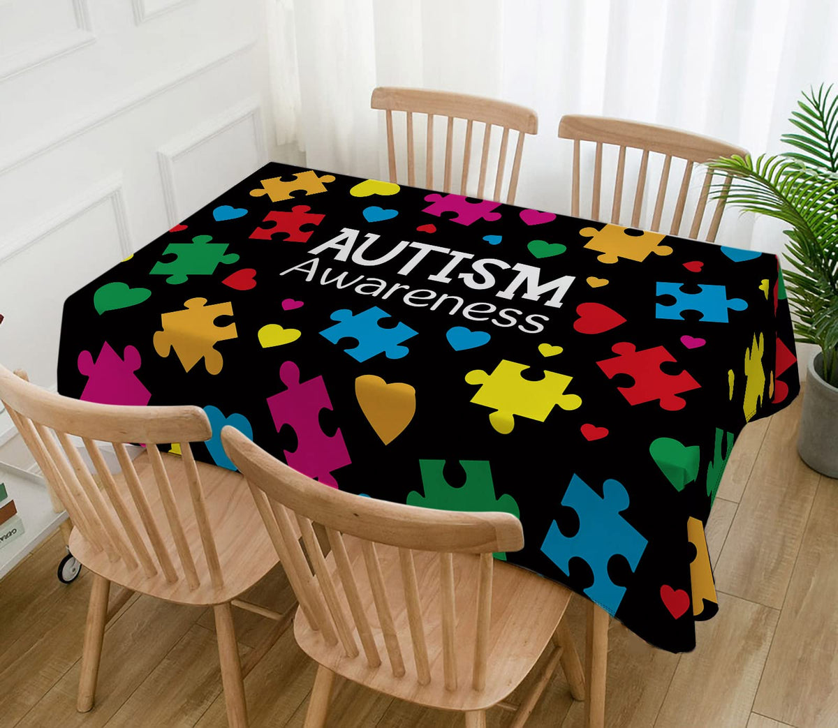 Hafangry autism-awareness decor tablecloth doubles as a photo backdrop.
