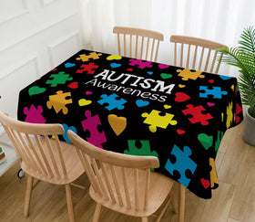Hafangry autism-awareness decor tablecloth doubles as a photo backdrop.