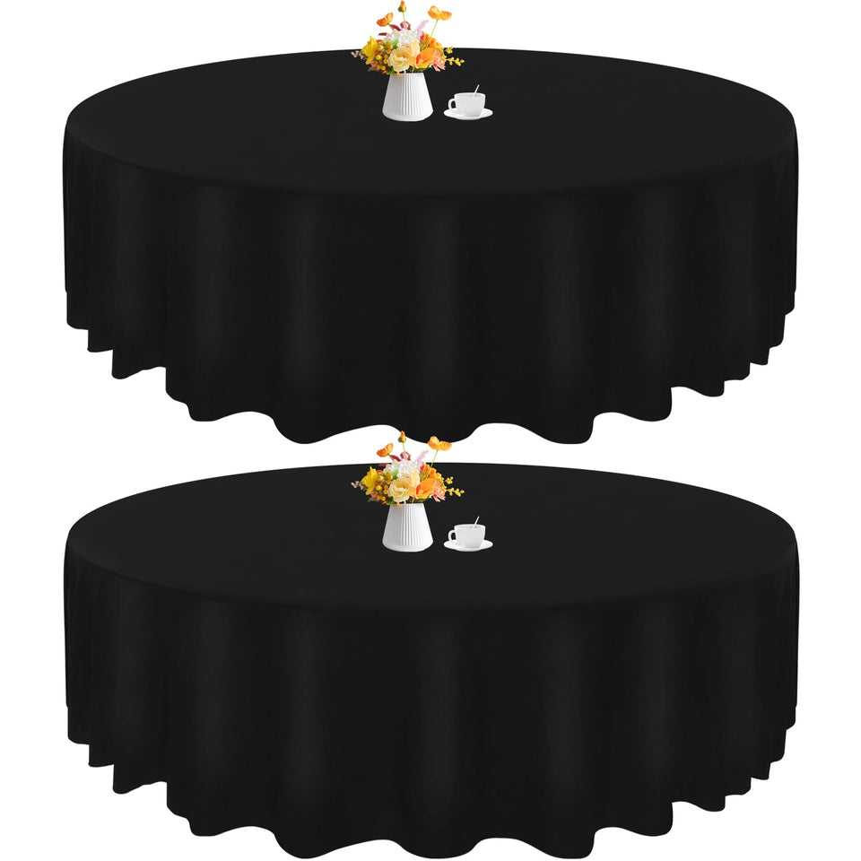 HAISIWLKJ 90-inch black round tablecloth draped for elegant dining.