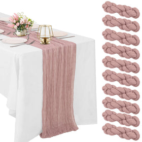 HAISIWLKJ dusty pink cheesecloth table runner laid out on a long dining table for weddings