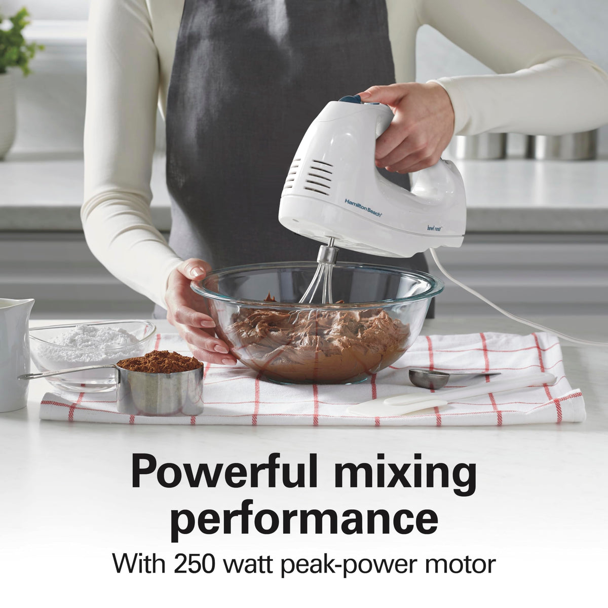 Hamilton Beach bowl rest keeps mixer stable during ingredient additions