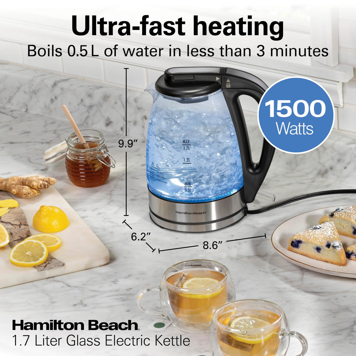 Hamilton Beach glass kettle with blue LED indicator during heating.