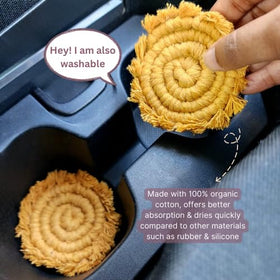 Uruba absorbent car coaster in action catching condensation to keep holders clean.