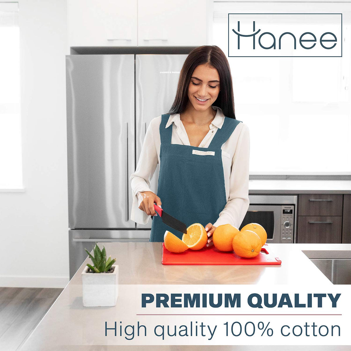 HANEE deep teal apron pockets close-up highlighting large tool storage