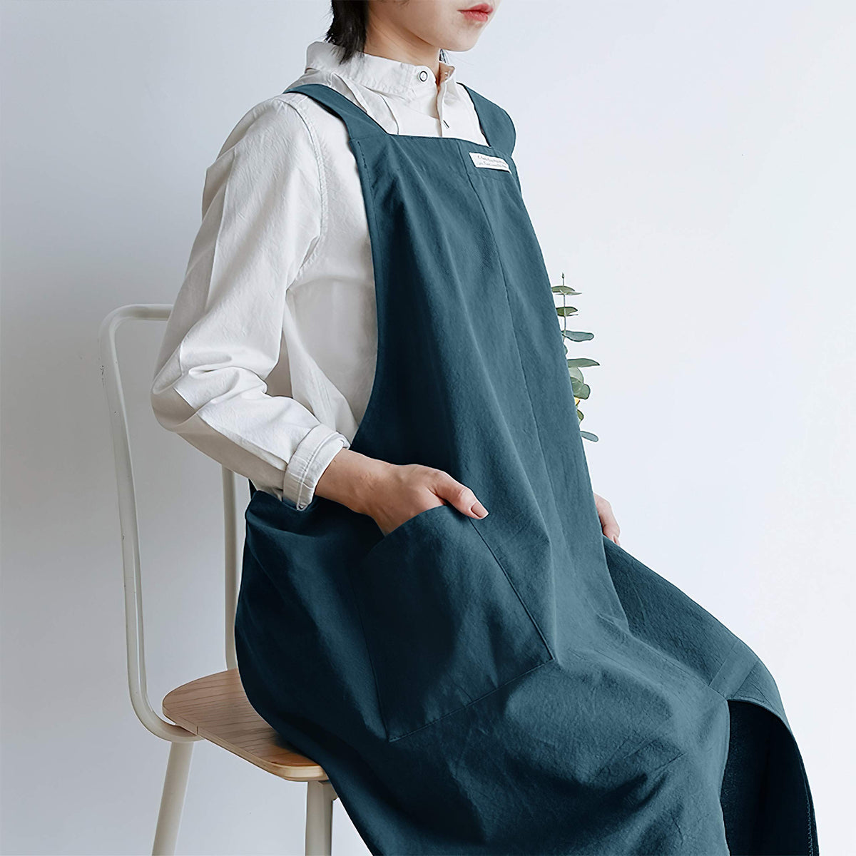 HANEE garden work with deep teal apron for tidy, organized tasks