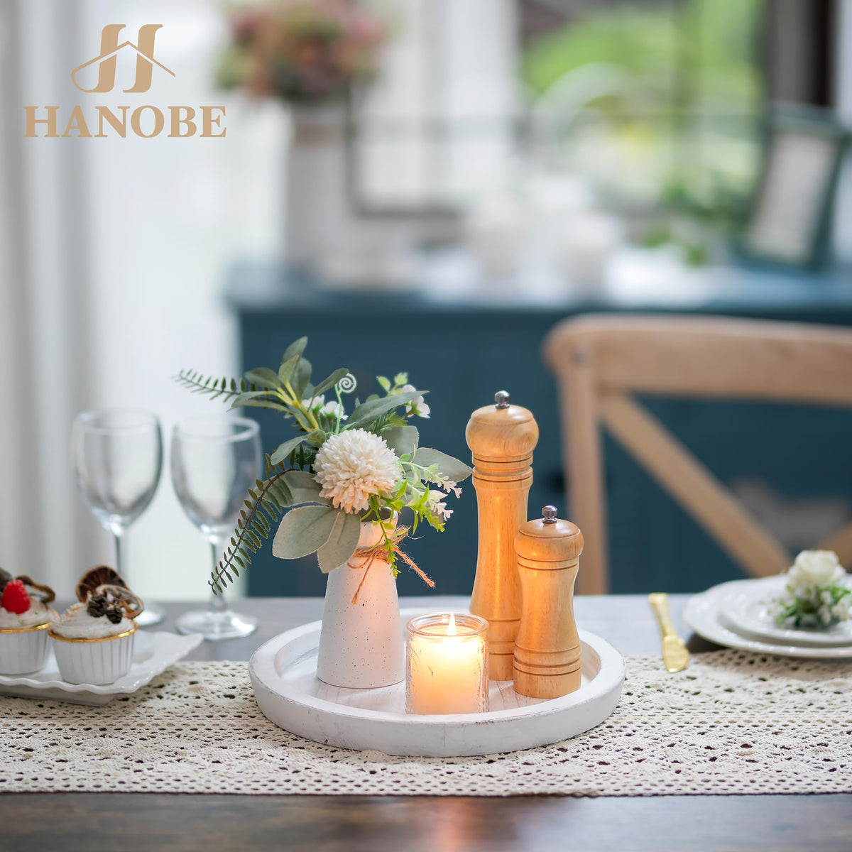 Hanobe flowers and candles arranged on tray for a warm centerpiece.