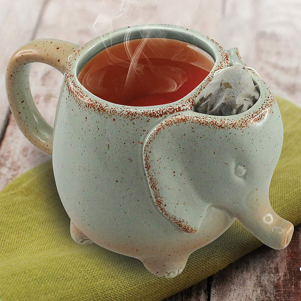 Happiness Apply Here elephant tea mug in green, perfect for cozy tea breaks with tea bag holder.