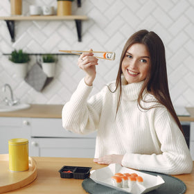 Hara Huri bamboo tongs flipping bacon without scratching cookware.