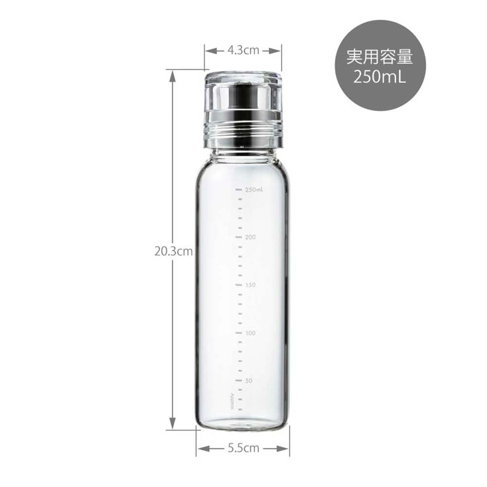 Hario dressing bottle in use for fresh homemade dressings on a salad.