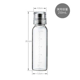 Hario dressing bottle in use for fresh homemade dressings on a salad.
