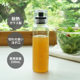 Hario dressing bottle showing measurement lines for accurate portions.