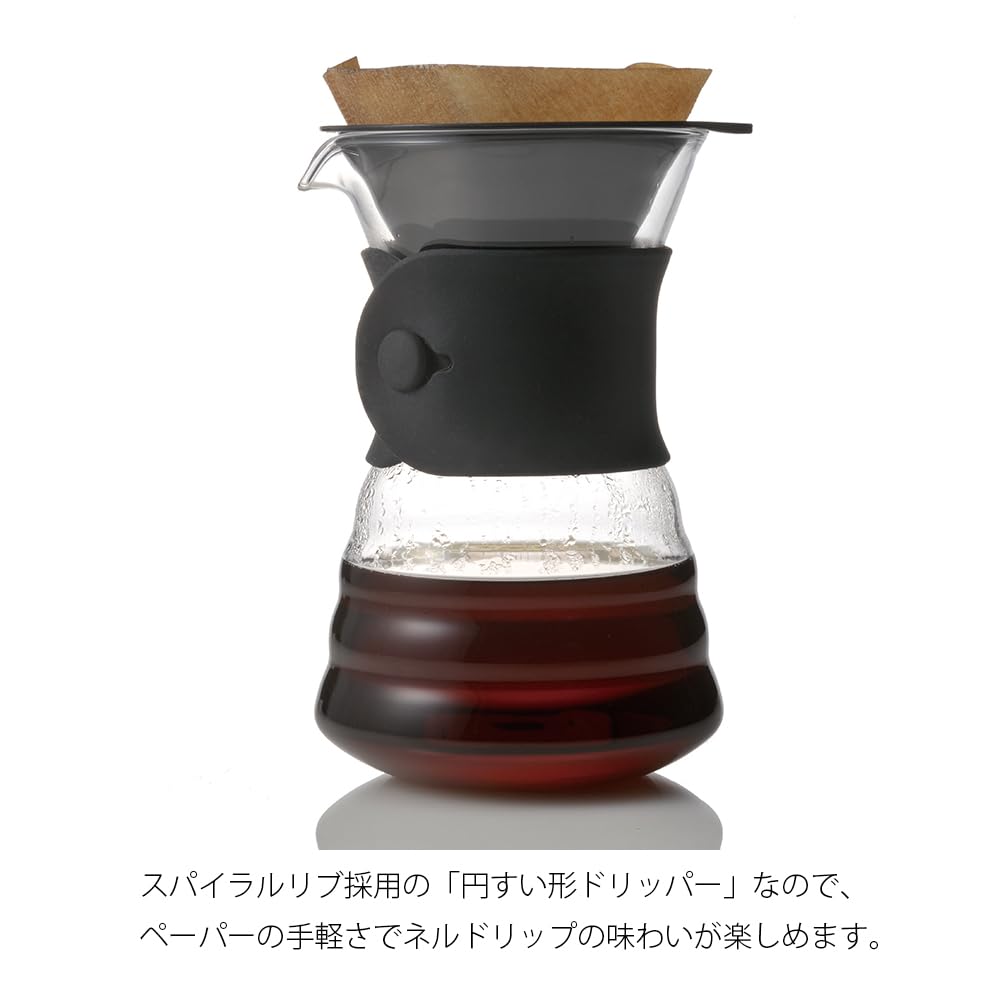 Hario V60 dripper over decanter with filter for clean extraction.