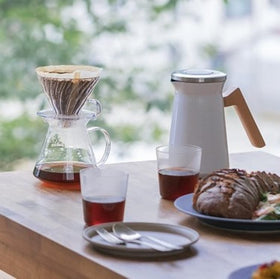 Hario V60 pour-over action shows controlled water flow.